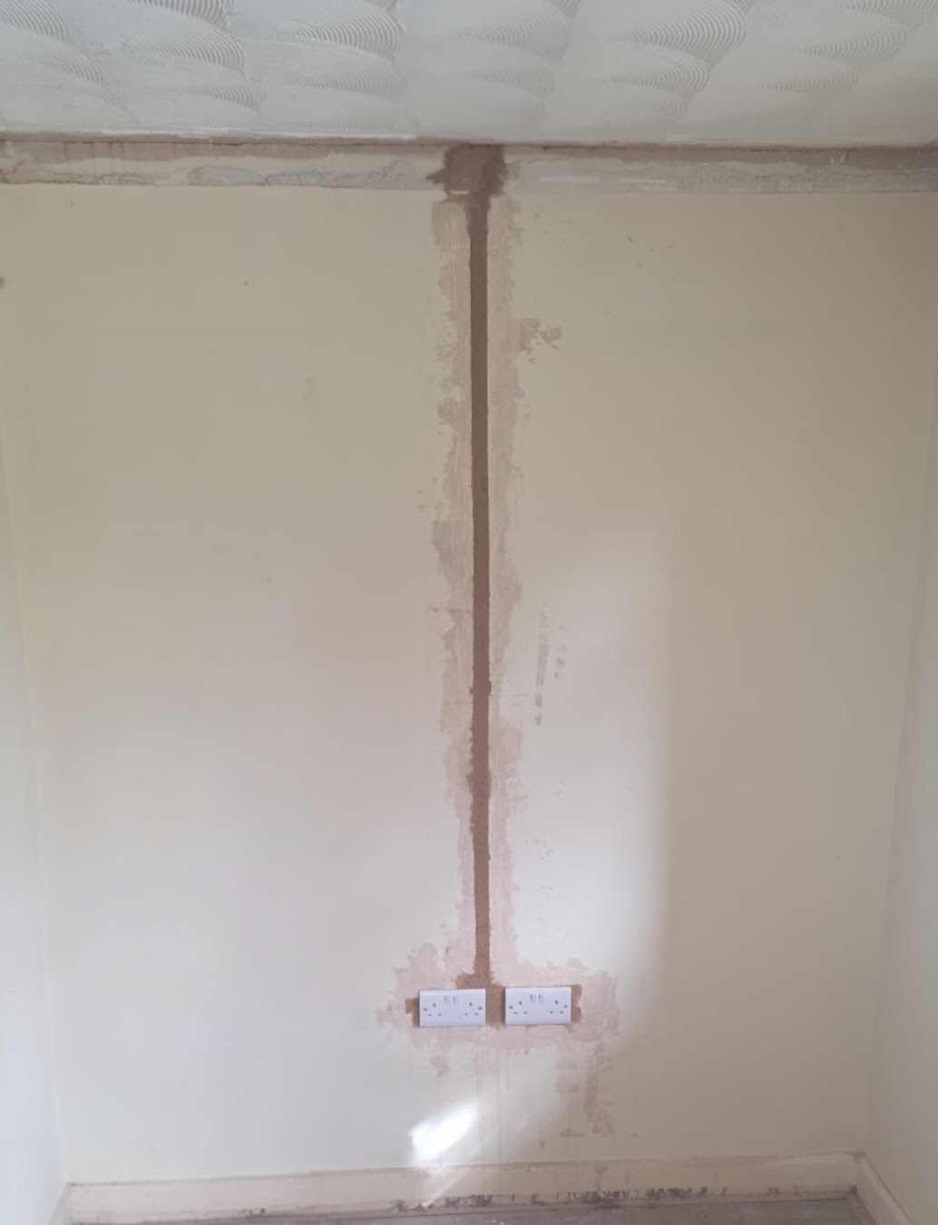 New double sockets chased into a wall by Bris Electrical